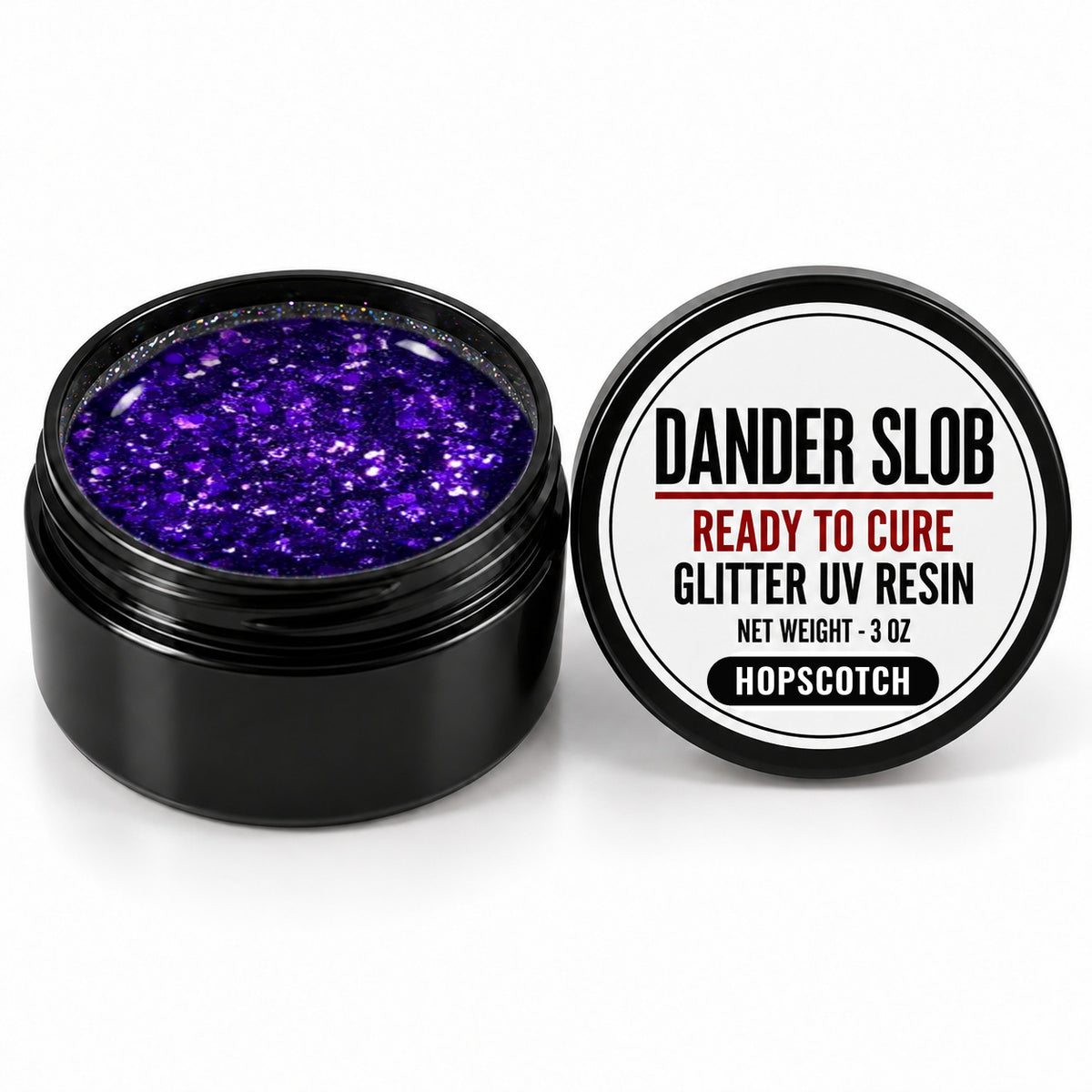 Craft Bully Dander Slob Hopscotch glitter UV resin in a 3 oz black jar.