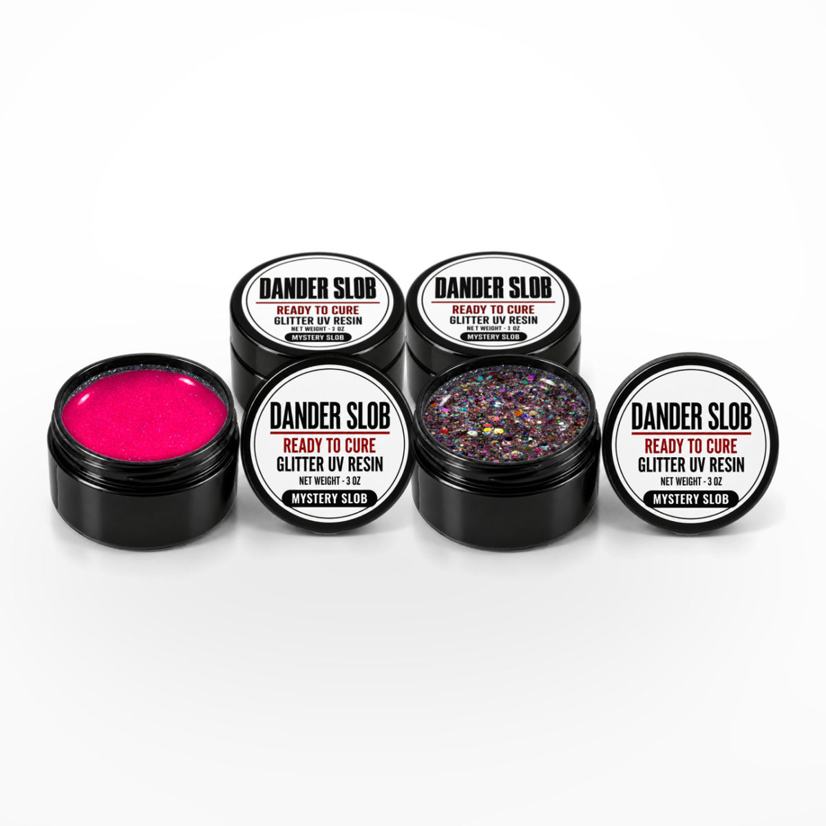 Craft Bully Dander Slob Mystery Slob 4 pack of 3 oz glitter UV resin jars, two open to show fine and chunky glitter.
