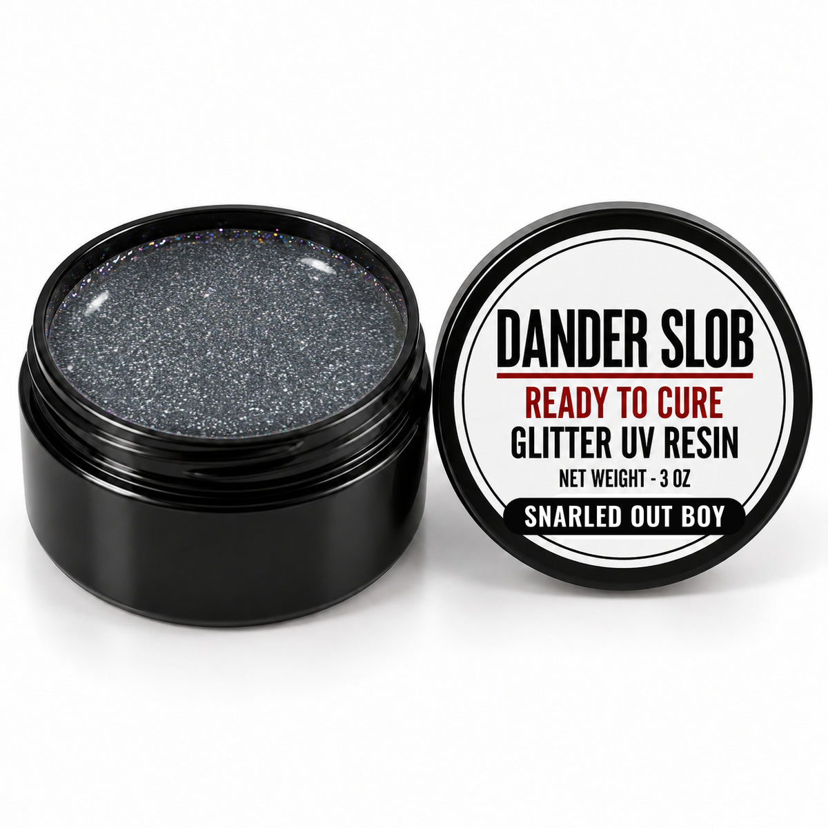 Craft Bully Dander Slob Snarled Out Boy glitter UV resin in a 3 oz black jar.